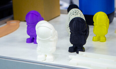 Abstract models printed on 3D printer. 3D printer created object from molten plastic. Modern...