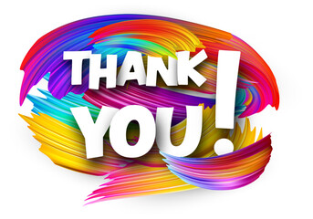 Thank you paper word sign with colorful spectrum paint brush strokes over white.