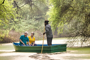 Senior couple tourist traveling on boat at lake