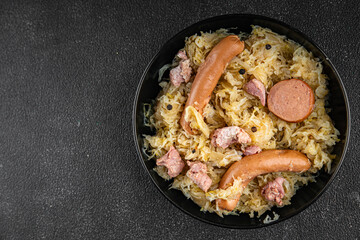 sauerkraut with garnish cabbage, meat, sausage tasty fresh delicious healthy eating cooking appetizer meal food snack on the table copy space food