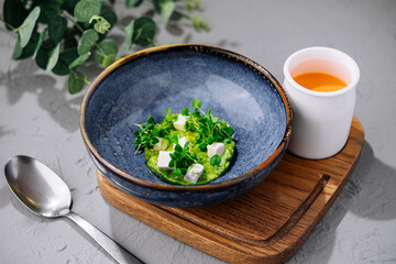 Broccoli, spinach cream soup in a bowl