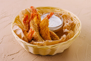 Tempura Shrimps in wood basket on the table