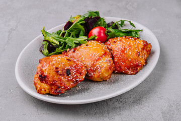 grilled chicken steaks with vegetable salad on plate