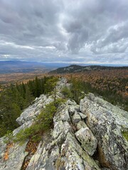 Mountain range, beautiful landscape from the top of the mountain, cloudy weather, stone placer.
