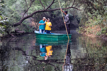 Old couple admiring view using binoculars during vacation post retirement