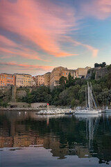 Fototapeta premium Corsica, Bastia, typical houses in the harbor in summer, sunset 