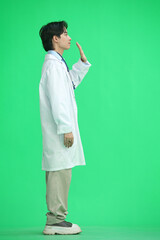 The guy is a doctor, on a green background, in full height, waving his hand