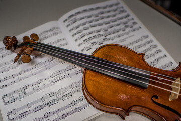 Fototapeta na wymiar Beautiful closeup shot of a classic violin, with its wooden body and bow.