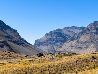 Cold climate landscape of the snow capped mountains with clear blue sky
