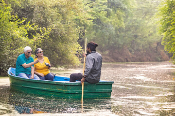 Senior couple tourist traveling on boat at lake