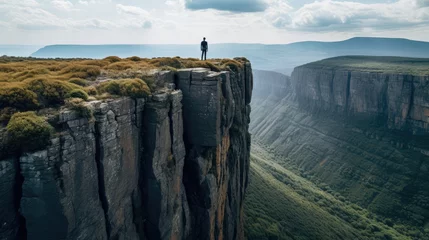 Fotobehang person on a cliff © faiz