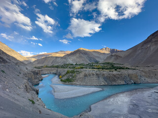 landscape of river in the mountains and blue cloudy sky