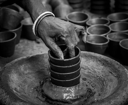 Pottery making involves shaping clay by hand, using a wheel, or coiling techniques.