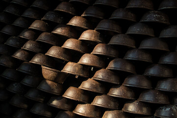 Pottery making involves shaping clay by hand, using a wheel, or coiling techniques.