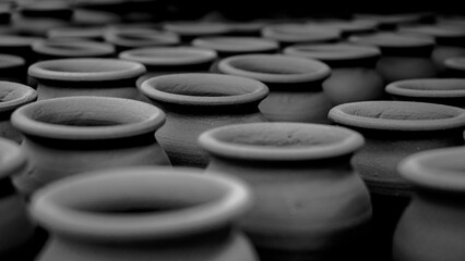 Pottery making involves shaping clay by hand, using a wheel, or coiling techniques.