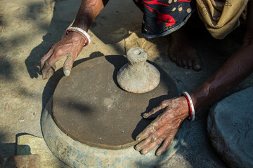 Pottery making involves shaping clay by hand, using a wheel, or coiling techniques.