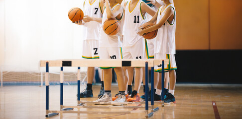 Young boys on basketball training. Group of school boys practicing basketball. Kids play sports...