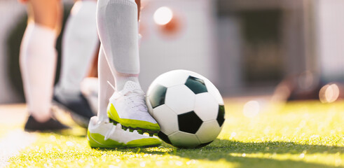 Soccer Ball in Motion Kicked by a Soccer Player. European Football Horizontal Background. Player in...