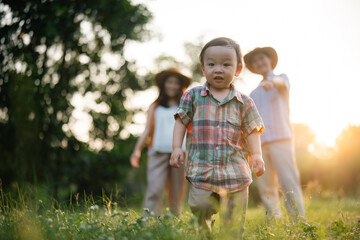 happy harmonious Asian family outdoors concept, Asian mother and son have activities happy fun...