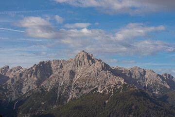 Scenic view of steep mount Haunold in majestic mountain range of untamed Sexten Dolomites, South Tyrol, Italy, Europe. Hiking concept in Italian Alps. Looking from top lift station of Helmjet Sexten