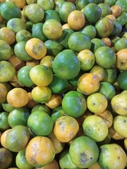 lots of yellow green oranges in traditional markets