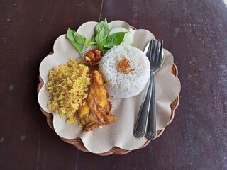 crispy chicken served with vegetables and rice