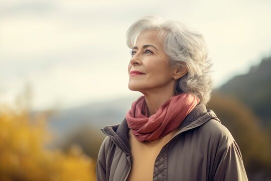 elderly lady in full contemplation of the landscape that surrounds her, thinking