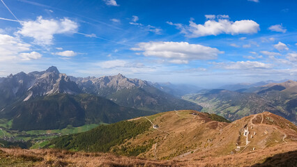 Fototapeta premium Scenic view of remote valley Fischleintal surrounded by majestic mountain range of untamed Sexten Dolomites, South Tyrol, Italy, Europe. Hiking concept Italian Alps. Looking from lift station Helmjet