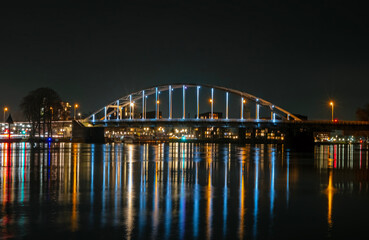 Fototapeta na wymiar View on the Wilhelmina bridge at the river IJssel near Deventer in the Netherlands by night