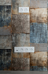Laser beam on wallpaper with a pattern of old tiles in different dark tones with nail heads. Level...