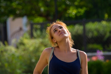 Young woman looks up in a village in Slovakia