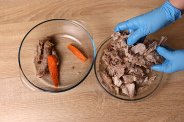 Salt and spices are added to the meat. Preparation of meat dishes.