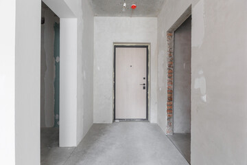 interior of the apartment without decoration in gray colors. rough finish
