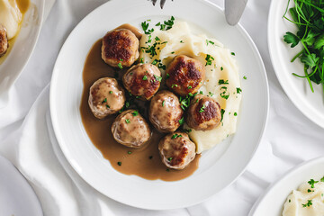 tasty meatballs with mashed potatoes and gravy on a plate, top view - obrazy, fototapety, plakaty