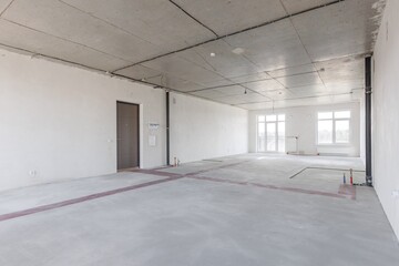 interior of the apartment without decoration in gray colors. rough finish