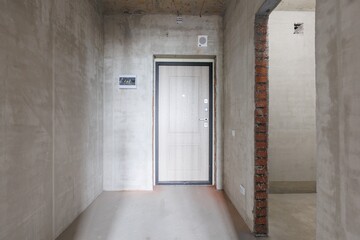 interior of the apartment without decoration in gray colors. rough finish
