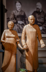 Alencon, France - 12 27 2023: Wooden statue of Saints Louis and Zélie Martin parents of Saint Thérèse inside Notre-Dame Basilica of Alençon. - obrazy, fototapety, plakaty