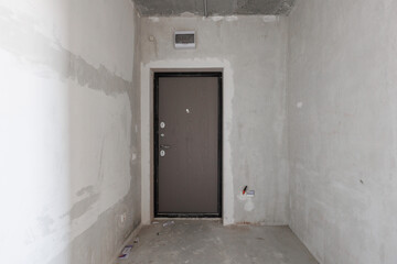 interior of the apartment without decoration in gray colors. rough finish