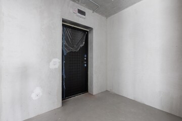 interior of the apartment without decoration in gray colors. rough finish