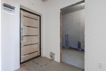 interior of the apartment without decoration in gray colors. rough finish