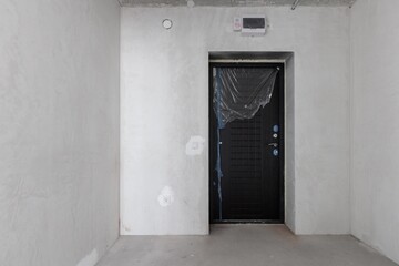 interior of the apartment without decoration in gray colors. rough finish