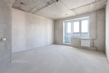 interior of the apartment without decoration in gray colors. rough finish