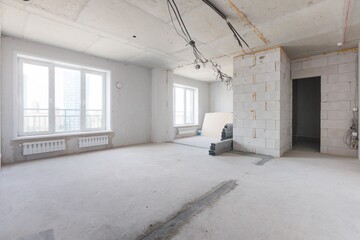 interior of the apartment without decoration in gray colors. rough finish