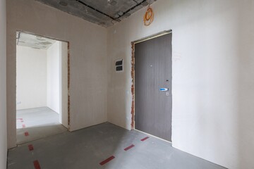 interior of the apartment without decoration in gray colors. rough finish