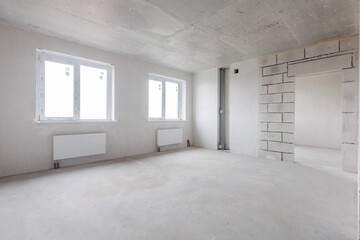 interior of the apartment without decoration in gray colors. rough finish