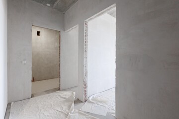 interior of the apartment without decoration in gray colors. rough finish