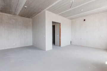 interior of the apartment without decoration in gray colors. rough finish