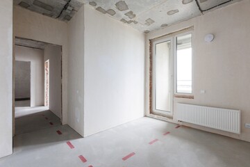interior of the apartment without decoration in gray colors. rough finish