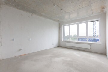 interior of the apartment without decoration in gray colors. rough finish
