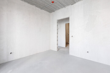 interior of the apartment without decoration in gray colors. rough finish